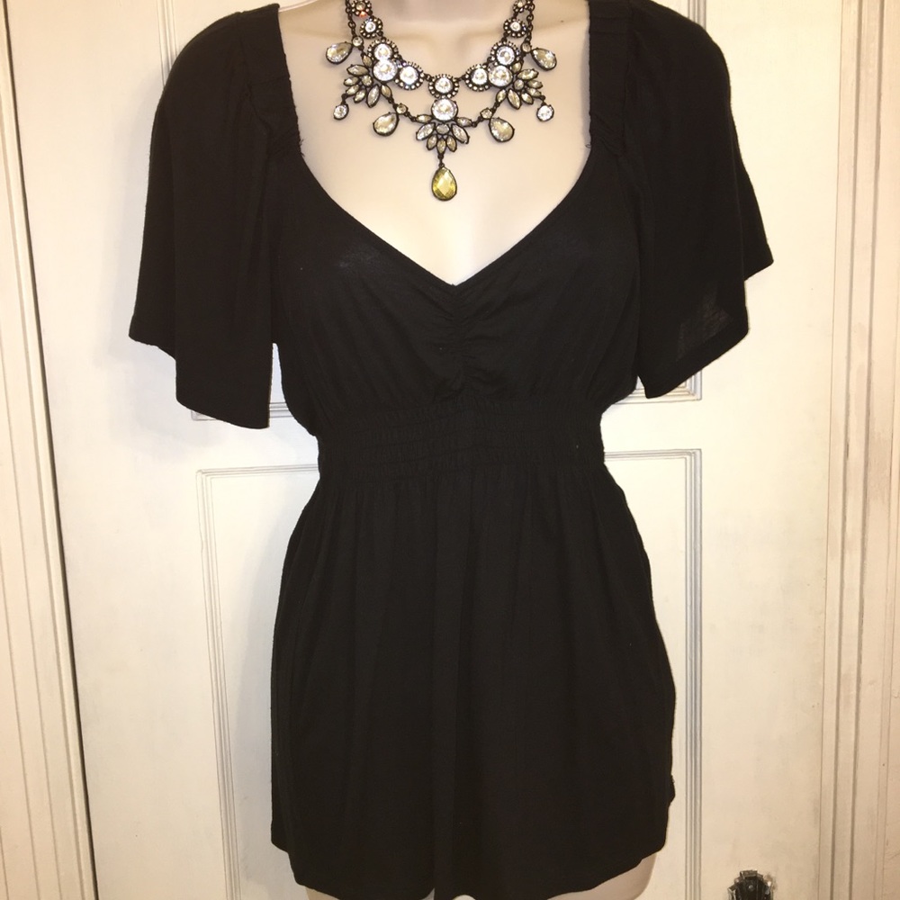 Limited knit top with shirred waist. Size S